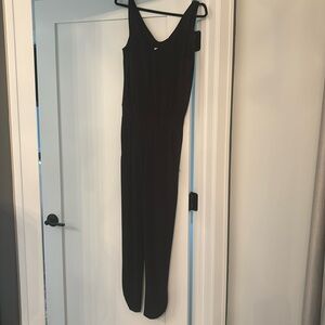 Sleeveless Romper. V-neck in front and back.